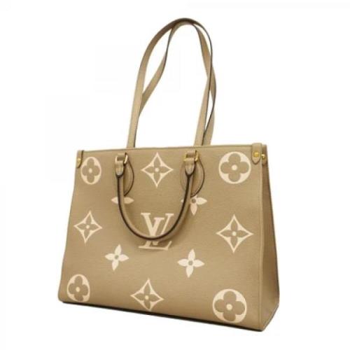 Louis Vuitton Vintage Pre-owned Tyg totevskor Beige, Dam